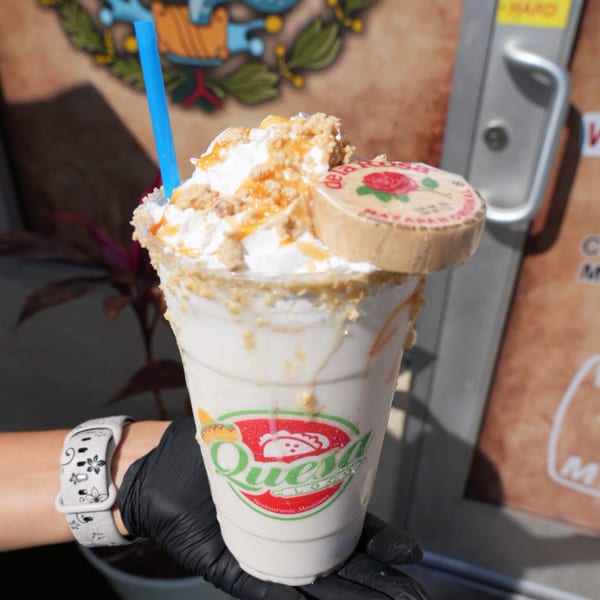 Quesa Loco's Mazapan milkshake, topped with whipped cream, caramel, cookie crumbles, and a Mazapan candy.