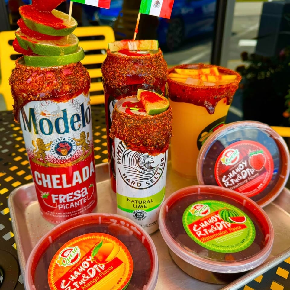 Mexican drinks and chamoy dips on a tray, including a Modelo Chelada and White Claw seltzer.